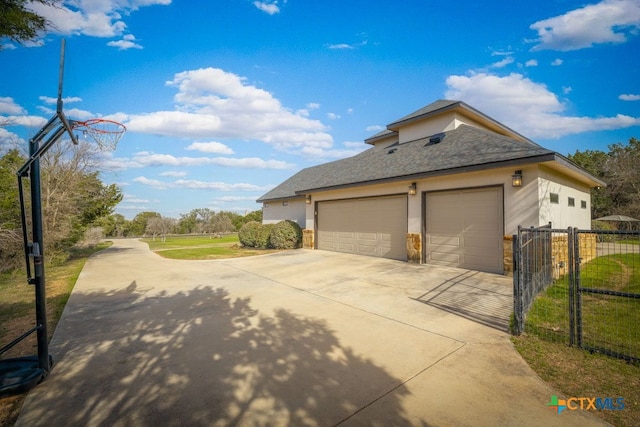 750 Cambridge Dr, New Braunfels, TX 78132 - view of property exterior featuring concrete driveway and stucco siding