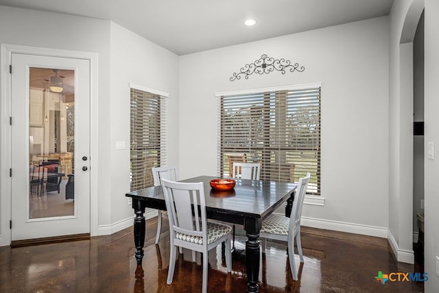 750 Cambridge Dr, New Braunfels, TX 78132 - dining area with arched walkways, finished concrete flooring, baseboards, and recessed lighting
