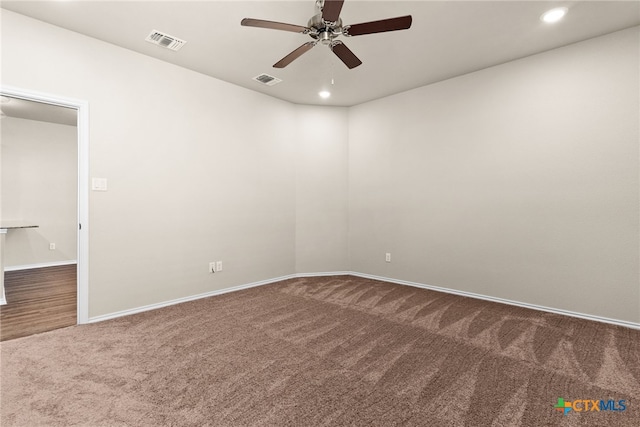 unfurnished room with carpet and ceiling fan