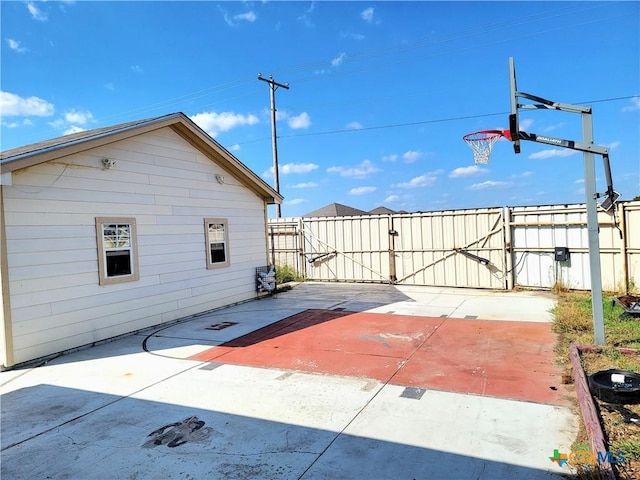 exterior space featuring fence and a gate