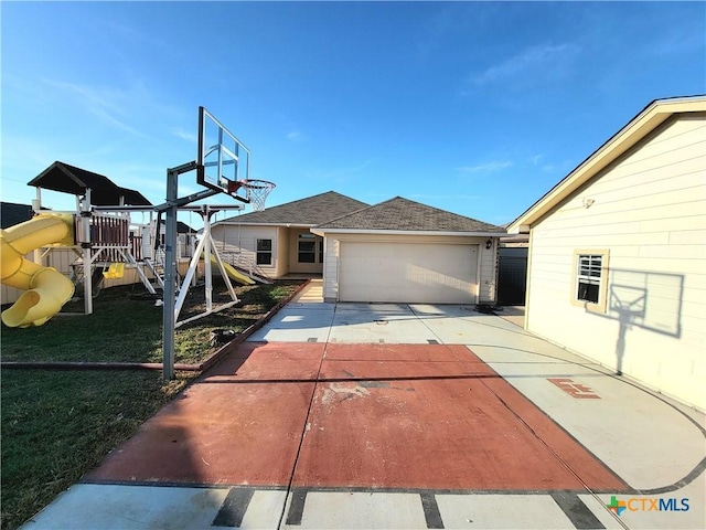 view of basketball court featuring a playground