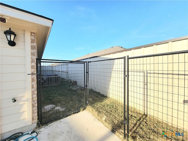 view of gate with fence