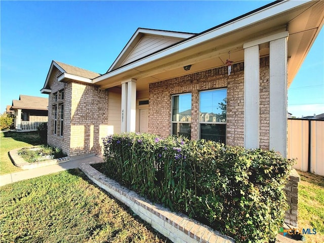 view of home's exterior with brick siding