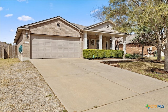 view of front facade featuring fence, a porch, concrete driveway, a garage, and brick siding