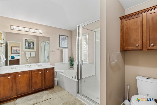 full bath with a bath, a stall shower, a sink, tile patterned flooring, and toilet