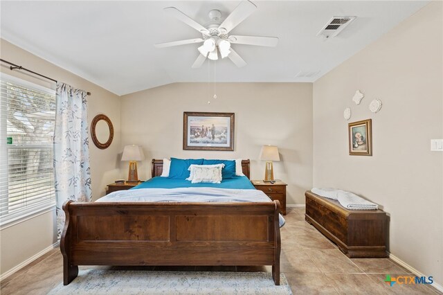 bedroom featuring visible vents, lofted ceiling, baseboards, and ceiling fan