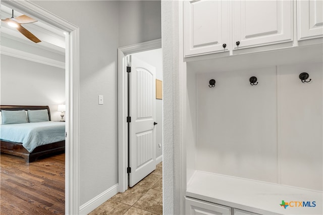 mudroom featuring light wood-type flooring and ceiling fan