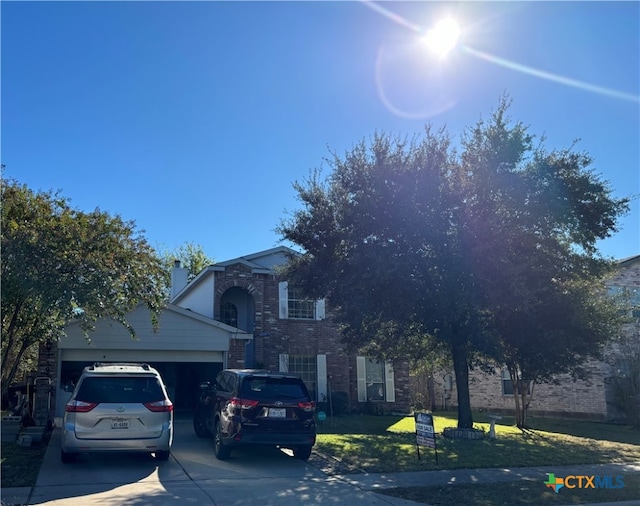 view of front facade featuring a front lawn and a garage