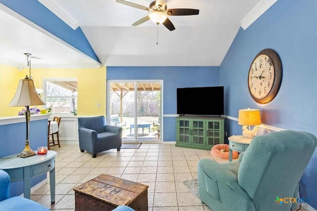 tiled living room featuring a wealth of natural light, lofted ceiling, and ornamental molding