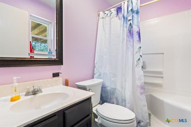 full bathroom with shower / bath combo, vanity, and toilet