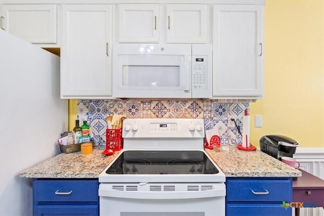 kitchen featuring tasteful backsplash, white appliances, and blue cabinets