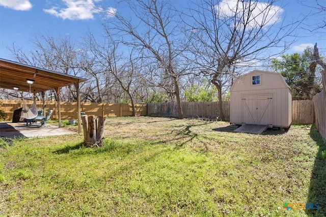 view of yard featuring a patio area, an outdoor structure, a fenced backyard, and a shed