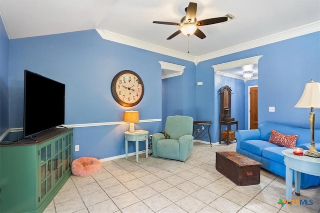 living room with tile patterned flooring, vaulted ceiling, ceiling fan, and crown molding