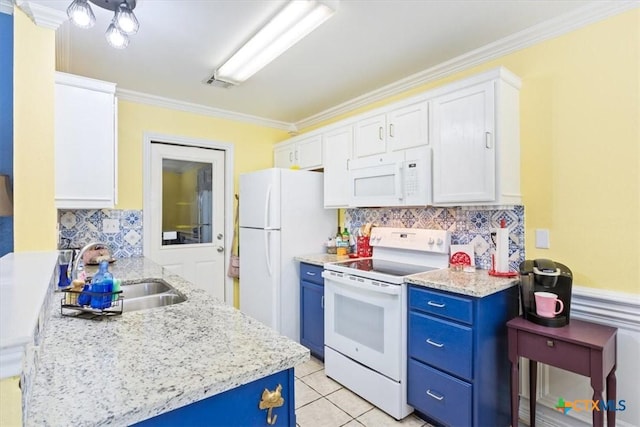 kitchen featuring white appliances, blue cabinets, crown molding, white cabinetry, and a sink