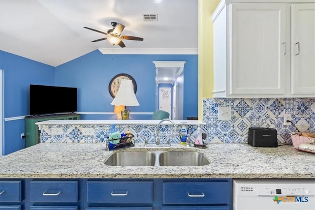 kitchen with blue cabinets, visible vents, dishwasher, and a sink