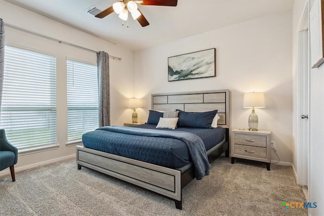 3703 Mccleland Creek Trl, Temple, TX 76502 - carpeted bedroom featuring multiple windows, baseboards, and a ceiling fan