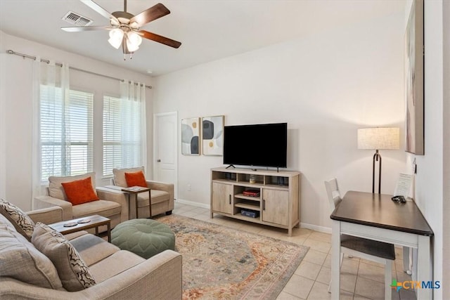 3703 Mccleland Creek Trl, Temple, TX 76502 - living area featuring a ceiling fan, light tile patterned floors, and baseboards