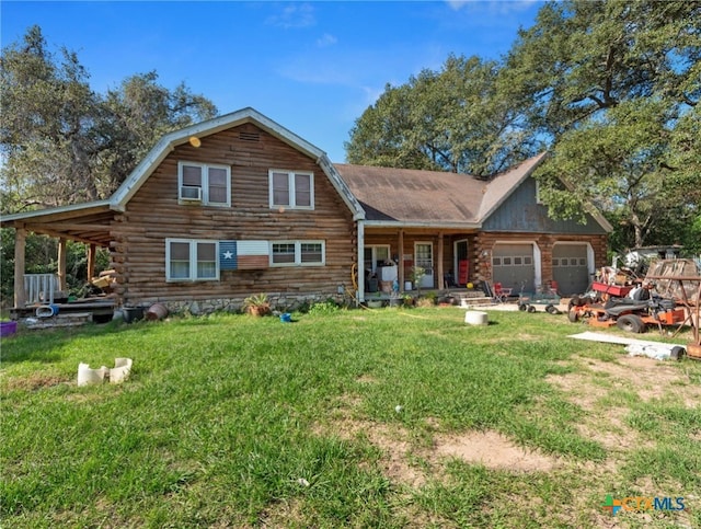 log home featuring covered porch, a garage, a front lawn, and cooling unit