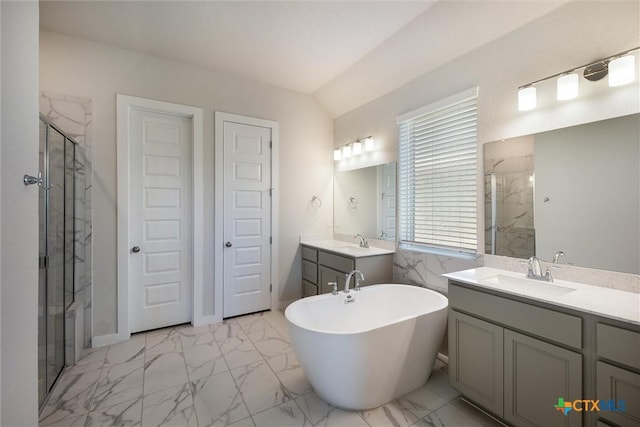 11305 Hollering Pass, Schertz, TX 78154 - bathroom featuring a marble finish shower, marble finish flooring, and two vanities