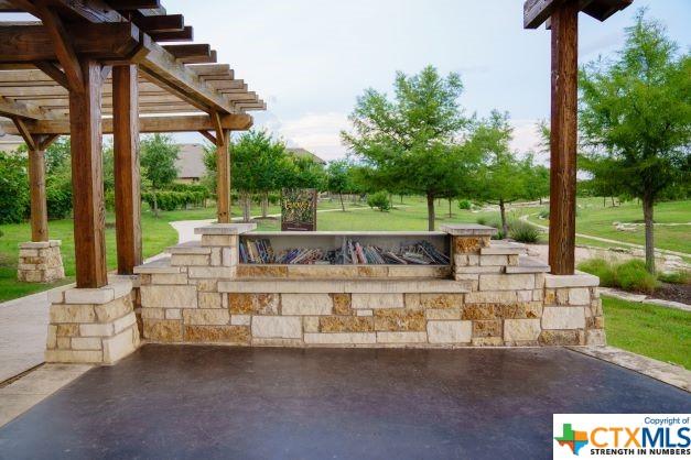11305 Hollering Pass, Schertz, TX 78154 - view of patio featuring a fire pit and a pergola