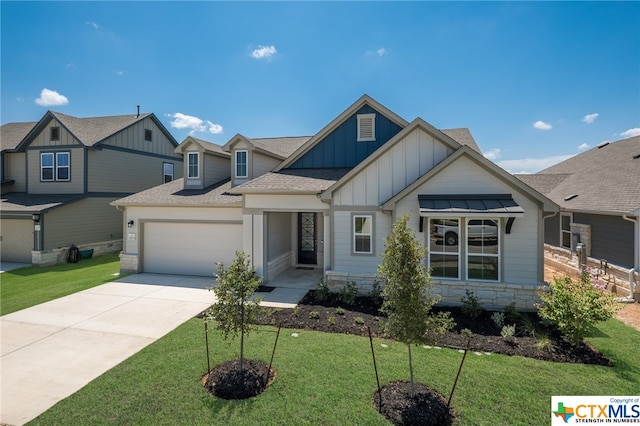 craftsman-style house with a garage and a front lawn