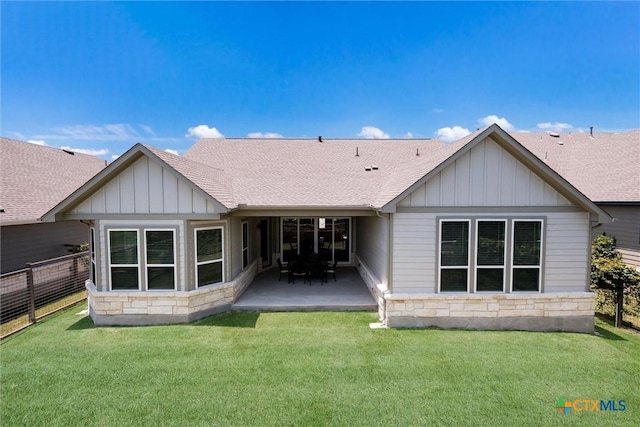 11305 Hollering Pass, Schertz, TX 78154 - back of property featuring stone siding, board and batten siding, and a patio