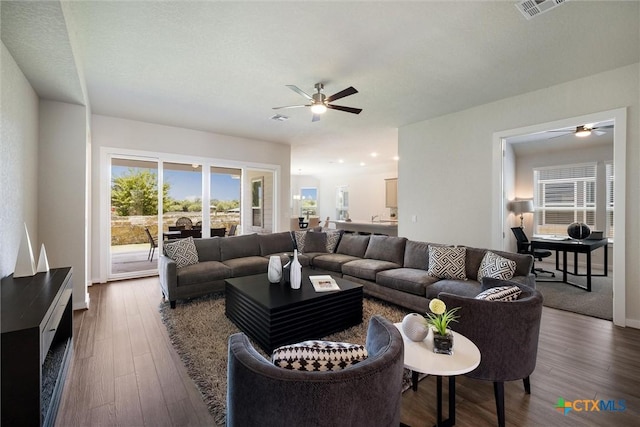 11305 Hollering Pass, Schertz, TX 78154 - living room with ceiling fan and dark wood-style flooring