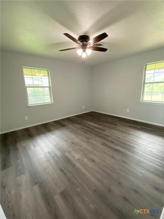 133 Country Acres Dr, Seguin, TX 78155 - empty room featuring baseboards, a ceiling fan, and dark wood finished floors