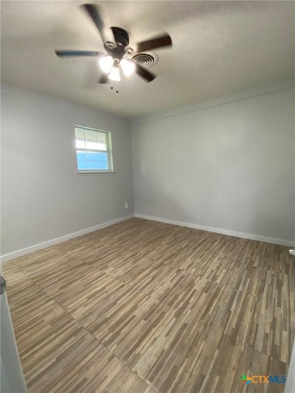 133 Country Acres Dr, Seguin, TX 78155 - empty room featuring a ceiling fan, baseboards, and wood finished floors
