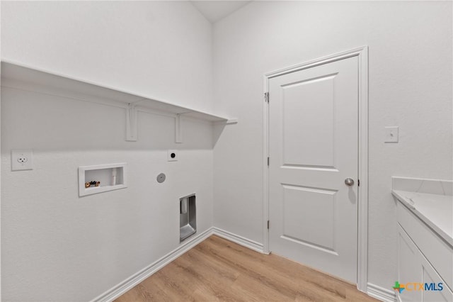 clothes washing area with laundry area, gas dryer hookup, hookup for an electric dryer, light wood-style floors, and washer hookup