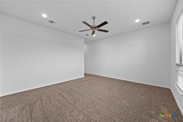 empty room with recessed lighting, baseboards, visible vents, and carpet flooring