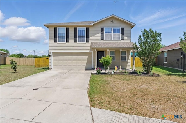 traditional-style home featuring driveway, a front lawn, fence, and a garage