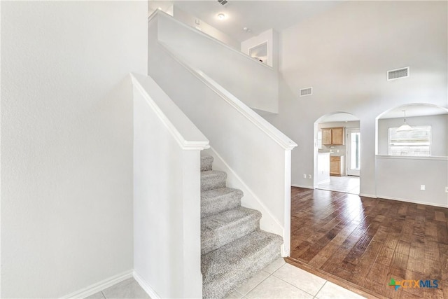 stairway featuring hardwood / wood-style flooring