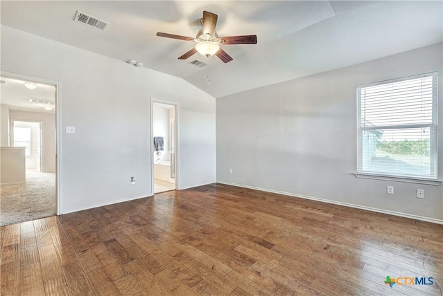 spare room with ceiling fan, lofted ceiling, hardwood / wood-style floors, and a wealth of natural light