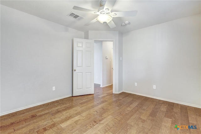 unfurnished room with ceiling fan and light hardwood / wood-style floors