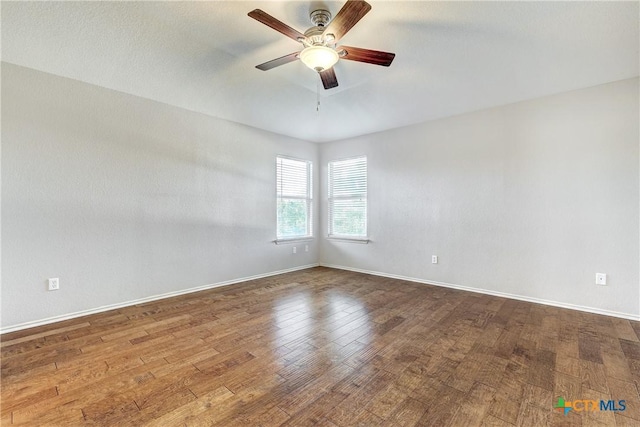 unfurnished room with hardwood / wood-style floors and ceiling fan