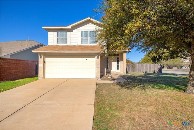 view of front of home with a front lawn and a garage