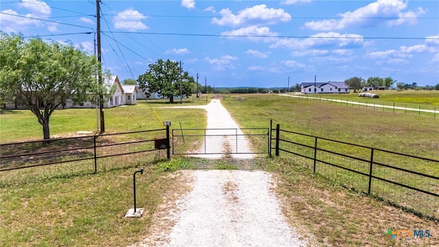 12011 Fm 1150, Luling, TX 78648 - view of dirt / gravel road with a view of rural / pastoral area, a gate, and a gated entry