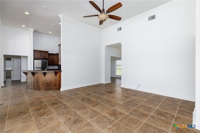 12011 Fm 1150, Luling, TX 78648 - unfurnished living room featuring ornamental molding, a ceiling fan, and recessed lighting