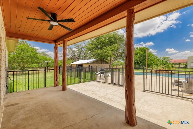 12011 Fm 1150, Luling, TX 78648 - fenced backyard with a ceiling fan and a patio area