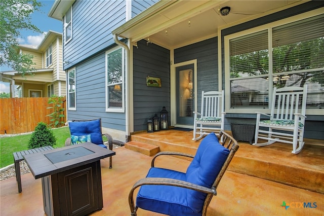 8713 Blackvireo Dr, Austin, TX 78729 - view of patio / terrace featuring an outdoor fire pit, fence, and covered porch