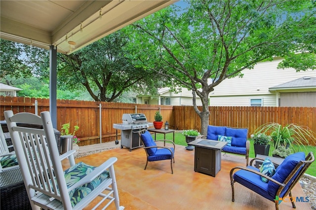 8713 Blackvireo Dr, Austin, TX 78729 - view of patio / terrace featuring a fenced backyard, an outdoor living space with a fire pit, and area for grilling