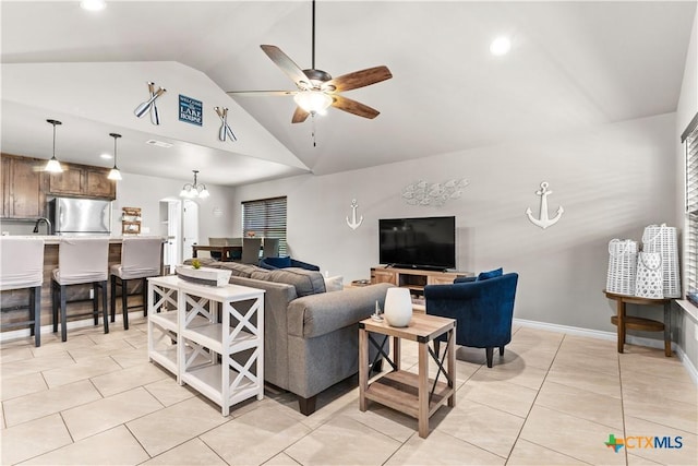 2319 Westview Dr, Canyon Lake, TX 78133 - living area featuring ceiling fan with notable chandelier, high vaulted ceiling, recessed lighting, and light tile patterned floors
