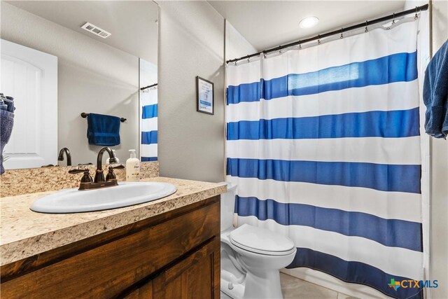 2319 Westview Dr, Canyon Lake, TX 78133 - bathroom with a shower with shower curtain, visible vents, toilet, and vanity