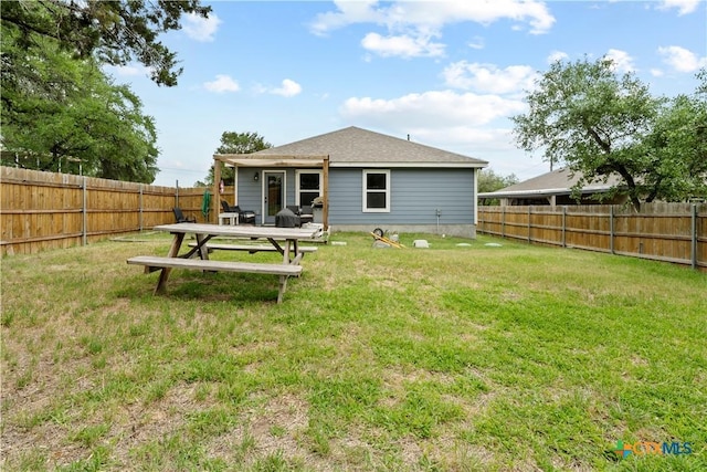 2319 Westview Dr, Canyon Lake, TX 78133 - back of house featuring a lawn and a fenced backyard