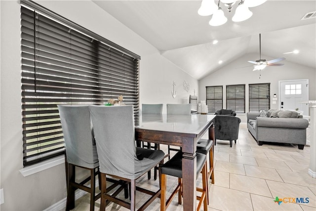 2319 Westview Dr, Canyon Lake, TX 78133 - dining space featuring light tile patterned flooring, vaulted ceiling, visible vents, and ceiling fan with notable chandelier