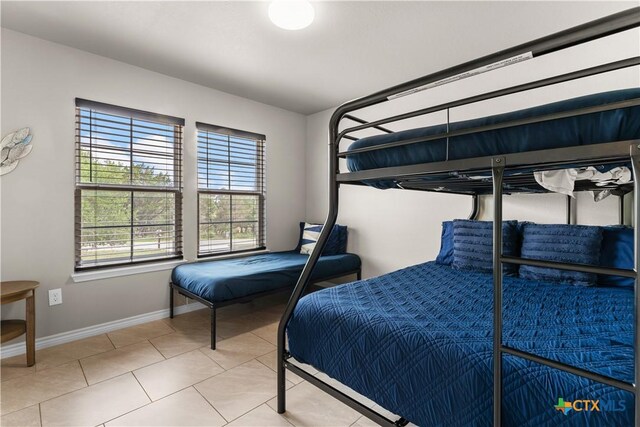 2319 Westview Dr, Canyon Lake, TX 78133 - tiled bedroom featuring baseboards