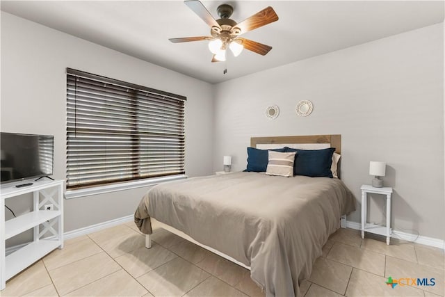 2319 Westview Dr, Canyon Lake, TX 78133 - bedroom featuring baseboards, a ceiling fan, and tile patterned floors