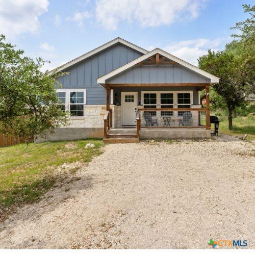 2319 Westview Dr, Canyon Lake, TX 78133 - view of front facade featuring board and batten siding and covered porch