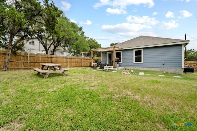 2319 Westview Dr, Canyon Lake, TX 78133 - back of property featuring a shingled roof, a fenced backyard, and a yard